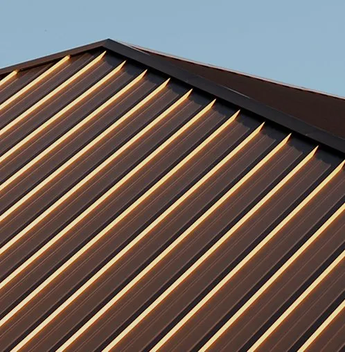 Copper standing seam roof on a bay window of an older New Jersey home, weathered to brown