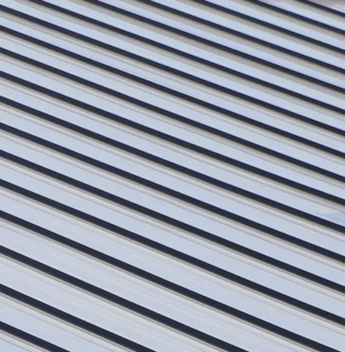 Standing seam roof panel leaving the roll former, cut to the length on a cut list