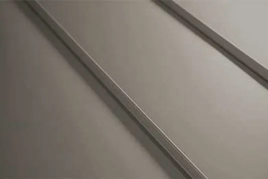 Close-up of a double-lock mechanical seam folded to 180 degrees on a standing seam metal roof